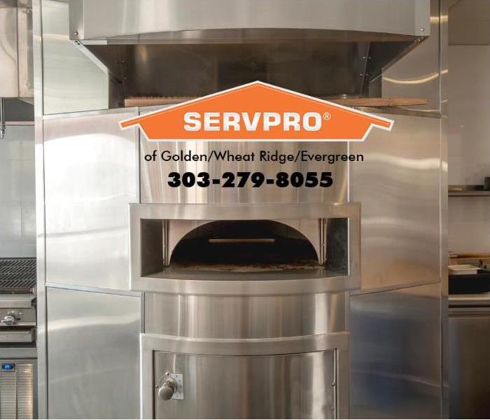 A pizza oven in a commercial restaurant is shown.